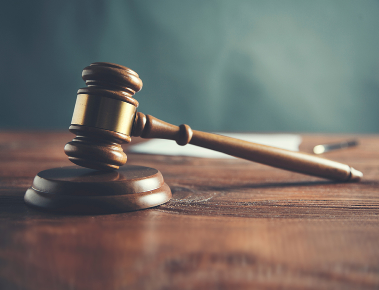 Judge’s gavel resting on a block, representing forensic analysis and expert testimony services