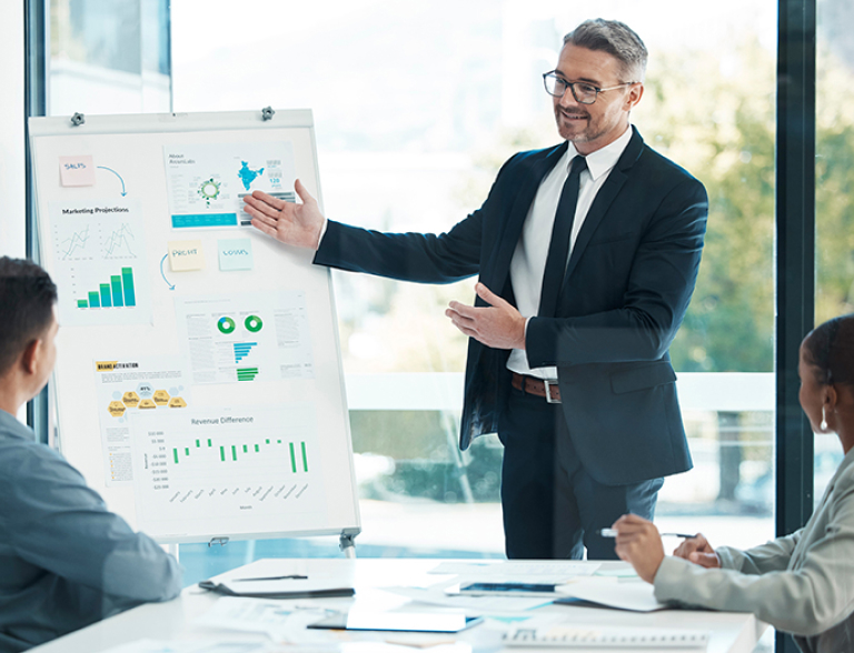 Businessman at chart presenting,  representing valuation and related services